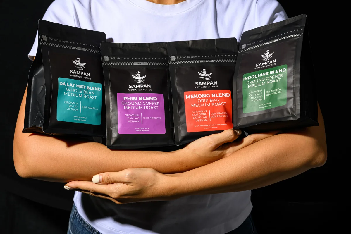 The four Sampan coffee blends — Phin, Indochine, Mekong and Da Lat Mist — arranged together